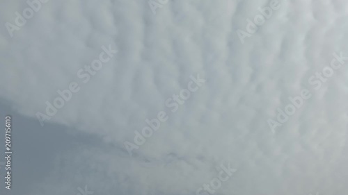 Soft textured overcast cloud pattern covering the sky creating a calm natural atmospheric background scene