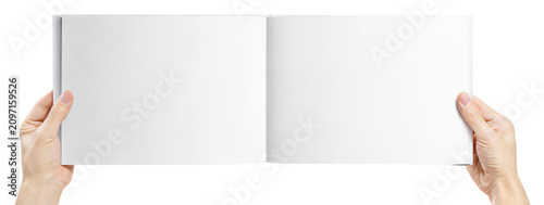 Photos Hands presenting panoramic hardcover book spread for mockup, isolated on transpa