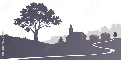 Fotografija Silhouette of a rural village with church and tree at dusk steeple