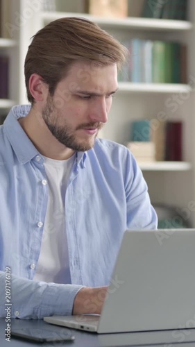 Man Feeling Distracted while using Laptop in Office, Vertical Video