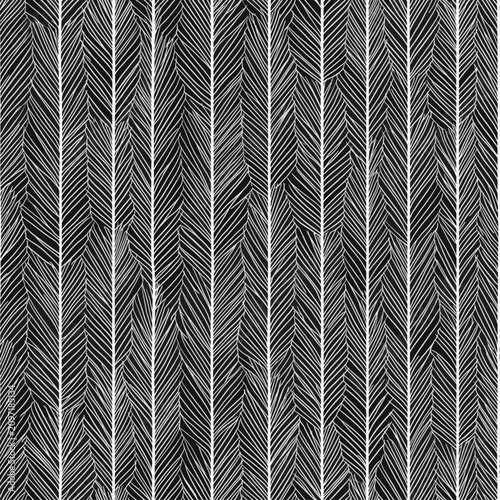 Abstract black and white seamless pattern forming a herringbone tropical leaf texture. Black and white abstract palm leaf herringbone pattern