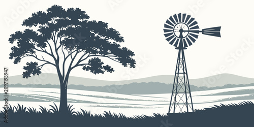 Tableau sur toile Windmill silhouetted against rural landscape with tree and mountains