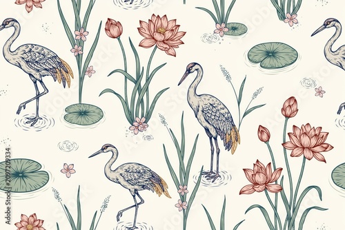Seamless pattern featuring hand-drawn herons standing in water with pink lotus flowers, green lily pads, and aquatic plants on cream background