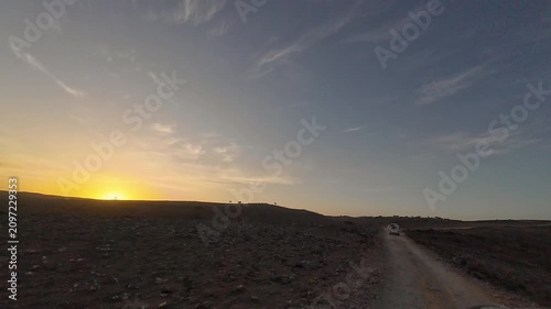 Dirt road through rocky desert at sunset. Socotra, Yemen.