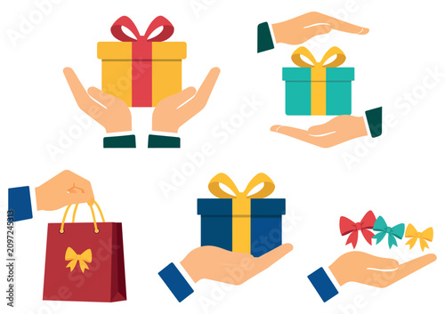 Hands holding gift boxes shopping bags and festive bows set with shopping, celebration