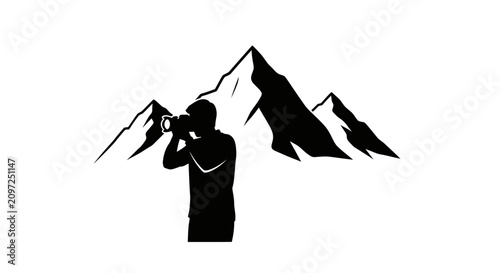 Bild auf Leinwand Photographer silhouette stands before mountain peaks to capture high altitude landscape imagery