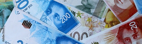 Fotografía Israeli new shekel money bills in pile on table