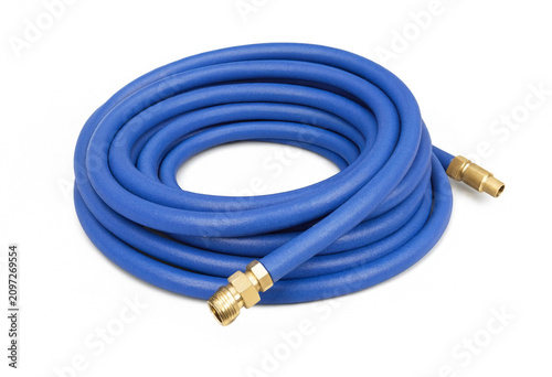 Coiled blue garden hose with brass fittings for outdoor watering isolated on white background, irrigation