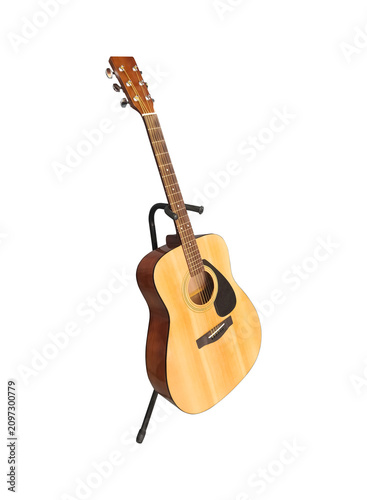 acoustic guitar with stand isolated on white background
