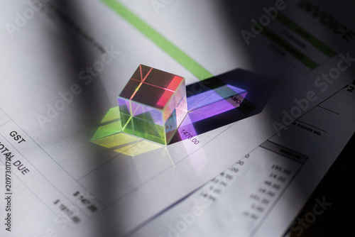 colourful paperweight on invoices including GST