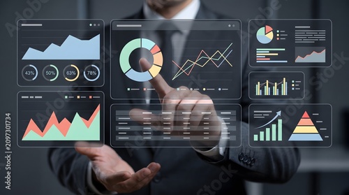 Businessman interacts with futuristic data analytics dashboard