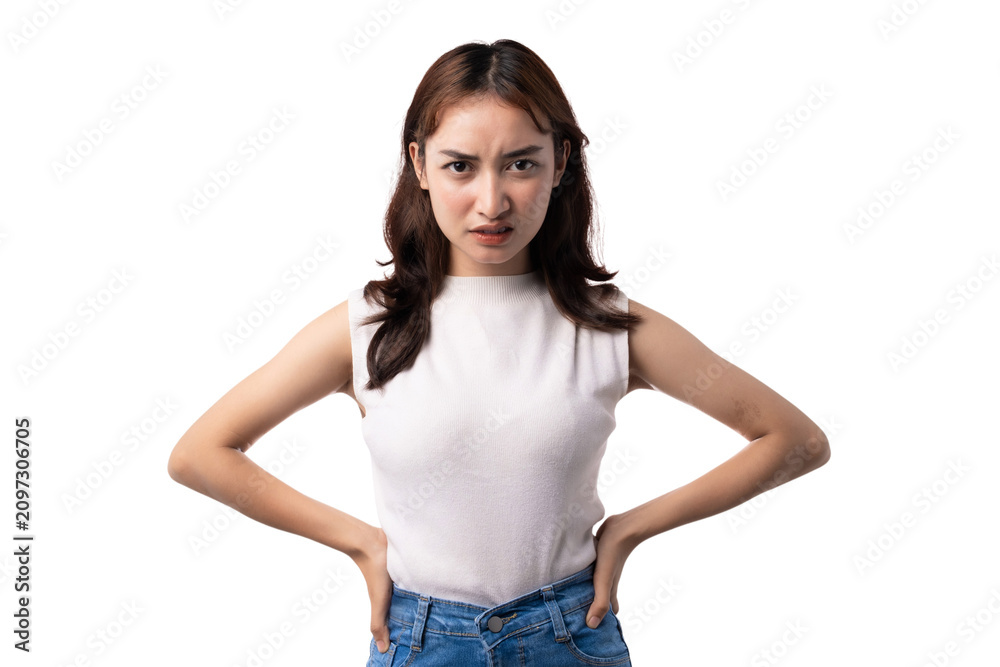 Fototapeta premium Serious young Asian woman standing with hands on hips on transparent background