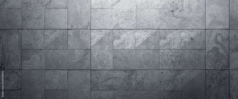 Fototapeta premium Gray Textured Wall Tiles in a Subtle Light Setting