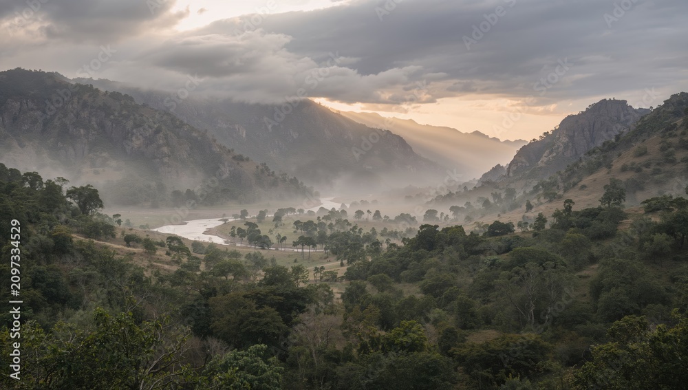 Obraz premium Mist Covered Valley with River and Mountains at Sunrise