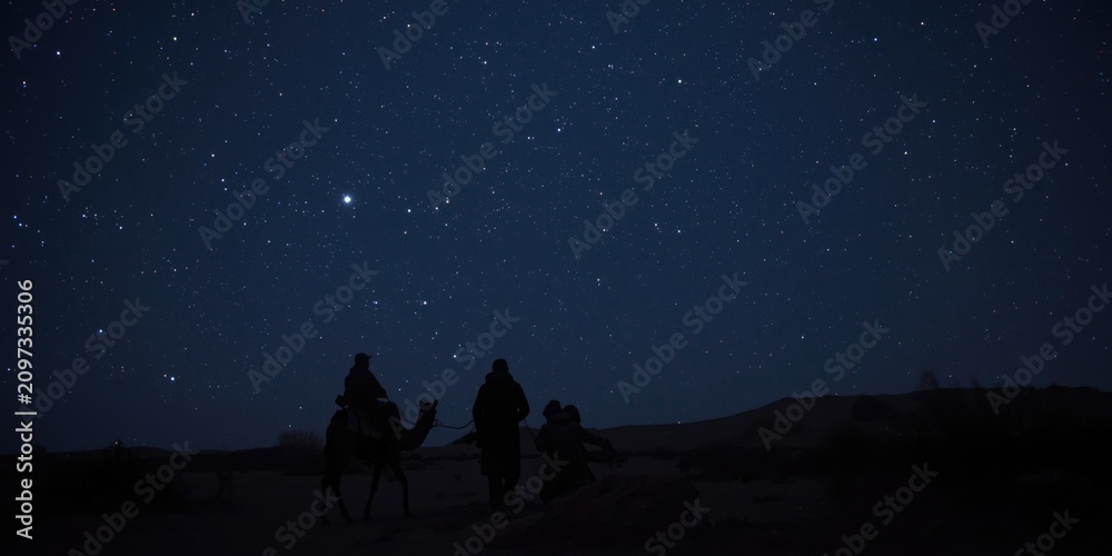 Fototapeta premium Silhouetted Camel Riders Stargazing Under a Starry Night Sky