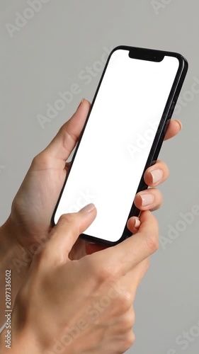 Hands holding a smartphone with a blank white screen