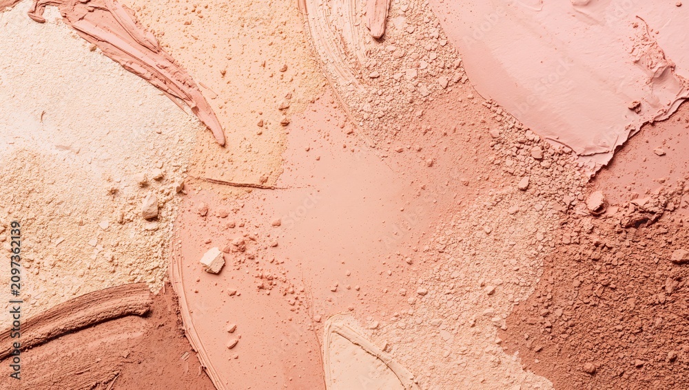 Fototapeta premium Colorful Textured Makeup Powder Blush in Warm Tones on Surface
