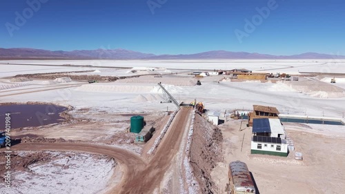 Drone aerial video of salt extraction facility, service road and processing ponds in Salinas Grandes, Argentina.