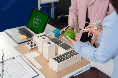 Engineer Teamwork Meeting, with partner on model building at company office working technology, Renewable energy-based green businesses and global warming.