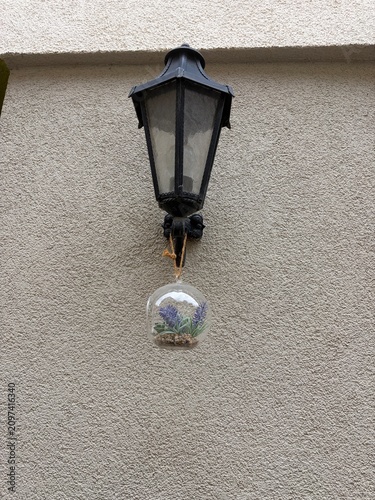 Vintage lantern attached to a traditional European facade