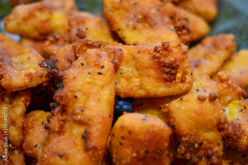 Photography fried chicken pieces chicken wings or nuggets, with an even browning and a thick
