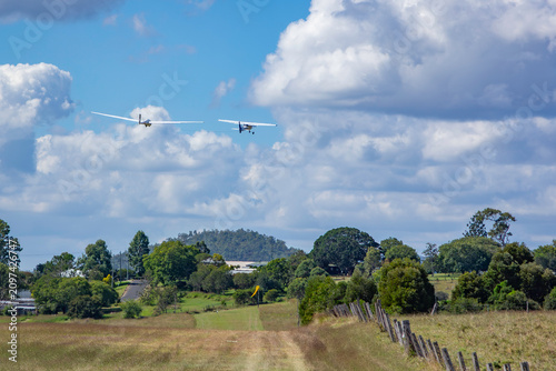 tow plane and glider in the sky