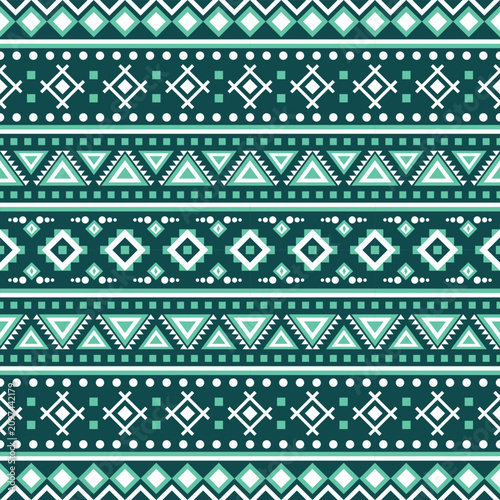 Seamless teal, white and dark green tribal geometric pattern featuring bohemian ethnic diamonds, triangles, dotted borders and folk-inspired ornamental textile design for fabric.