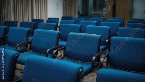 Blue seating arranged in a ...