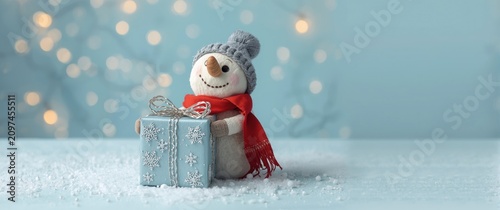 Snowman Holding a Gift Box ...