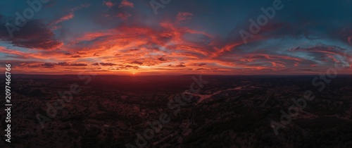 Colorful sunset over a vall...
