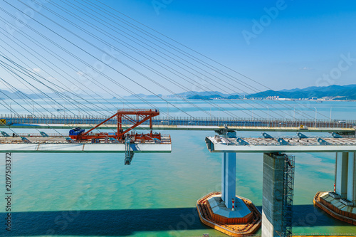 Canvas-taulu Bridge girder launcher crane installing a steel segment on a cable-stayed bridge
