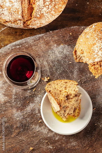 Homemade artisan sourdough bread on a rustic wooden cutting board