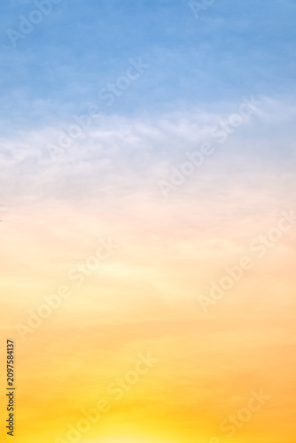 Canvastavla Sunset or sunrise sky with a vibrant gradient of orange, gold, and soft blue