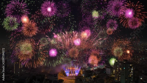 Spectacular burst of colorful fireworks illuminating the night sky above a vibrant city celebration, creating a breathtaking and festive atmosphere for a grand event