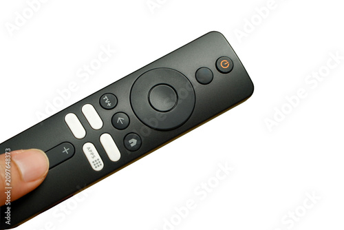 man's hand holding the smart tv remote is separated from the white background in the copied area.