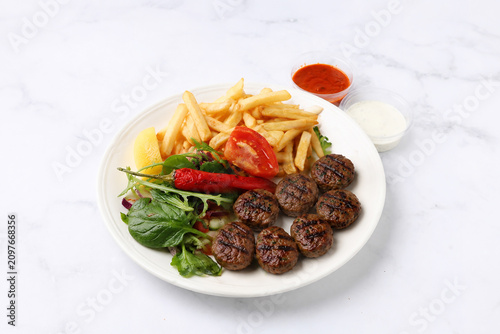 Grilled Beef Meatballs- Grilled Chicken Kebab with French Fries, Fresh Salad, Tomato and Garlic Sauce