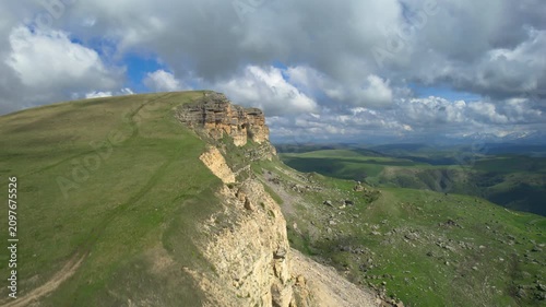 Aerial view of a mountain plateau with high cliffs. Landscape and nature of the North Caucasus.