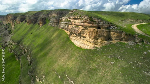 Aerial view of a mountain plateau with high cliffs. Landscape and nature of the North Caucasus.