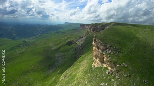 Aerial view of a mountain plateau with high cliffs. Landscape and nature of the North Caucasus.