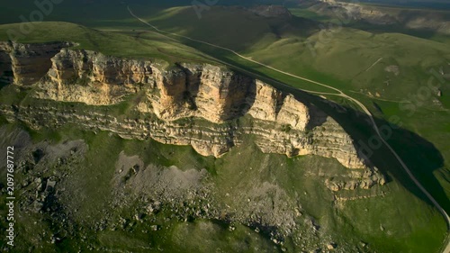 Aerial view of a mountain plateau with high cliffs. Landscape and nature of the North Caucasus.