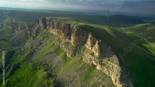 Aerial view of a mountain plateau with high cliffs. Landscape and nature of the North Caucasus.