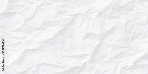 Photos Crumpled white paper texture background with creases and folds
