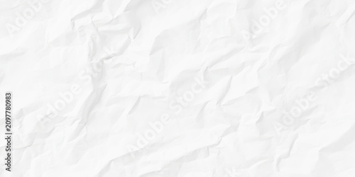 Crumpled white paper texture background with wrinkled folds and creases everywhere seen closely