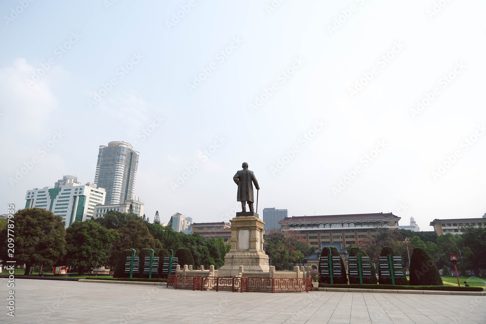 Fototapeta premium Back View of Dr. Sun Yat-sen Bronze Statue and City Skyline in Guangzhou China