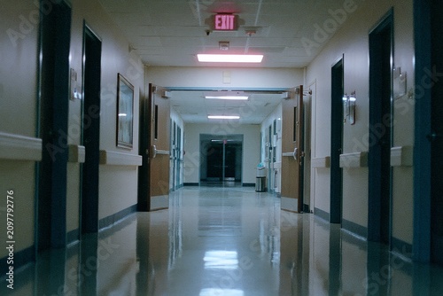 Glowing emergency exit at th, realistic atmosphere and detailed visual setting