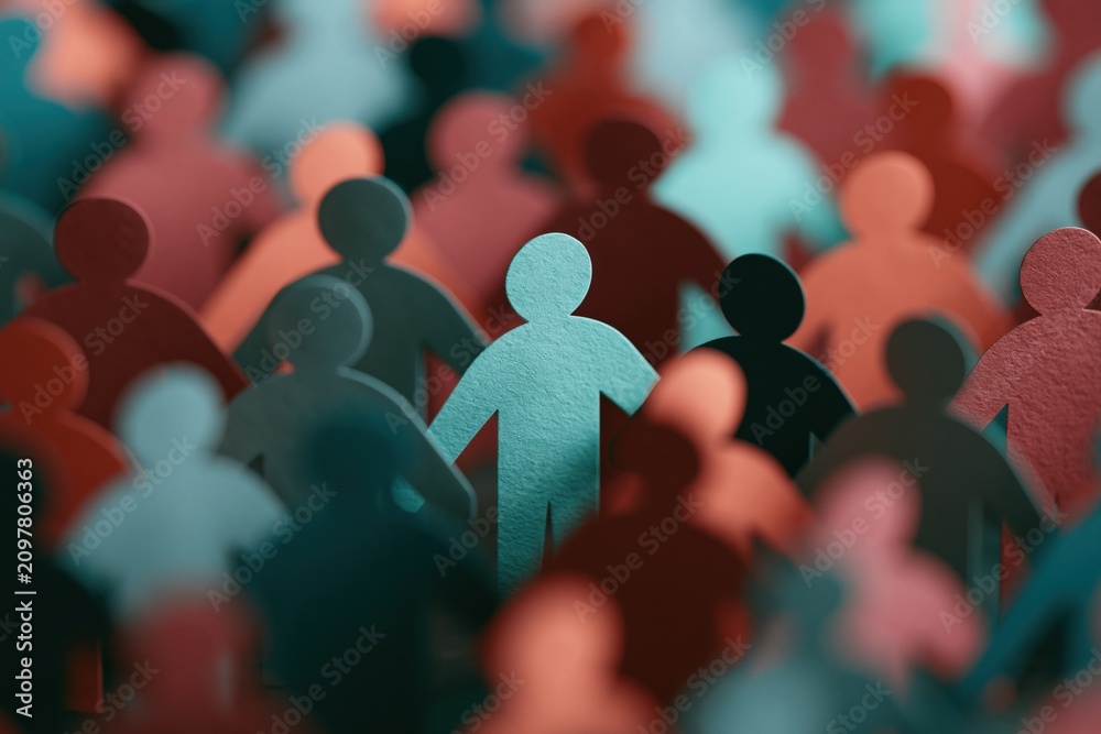 Obraz premium Paper cutout crowd background community composition featuring a central teal figure for banner and poster design
