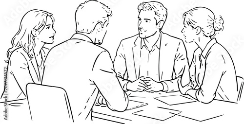 Business meeting with four people discussing ideas around a table