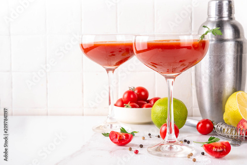 Canvas Print Alcohol tomato martini, tomatini cocktail with lemon and lemon juice, spices and salt