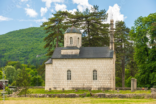 Cetinje Monastery building standing amid green nature, Montenegro