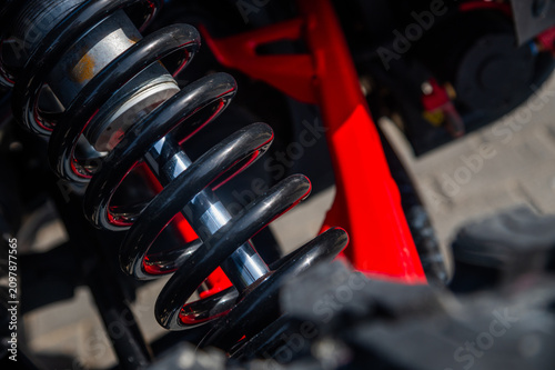 Bild auf Leinwand Close-up of automotive coil spring and suspension components in vehicle